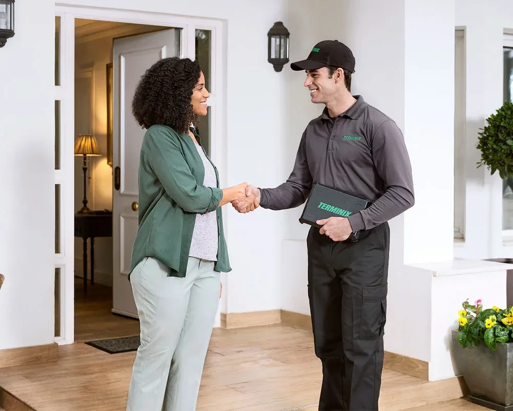 Tech shaking hands with customer