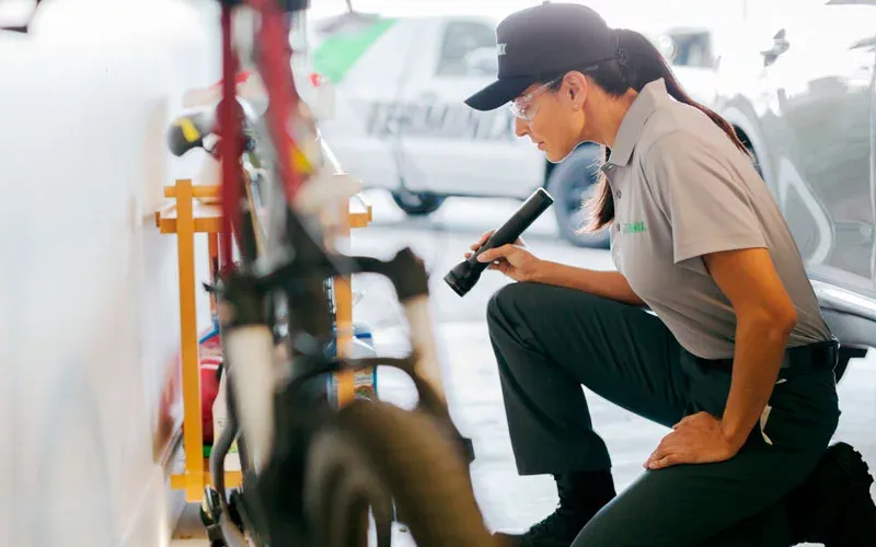 technician inspecting garage